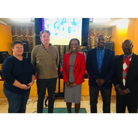 Facilitators and participants standing together after Mental Health First Aid in Brockton.